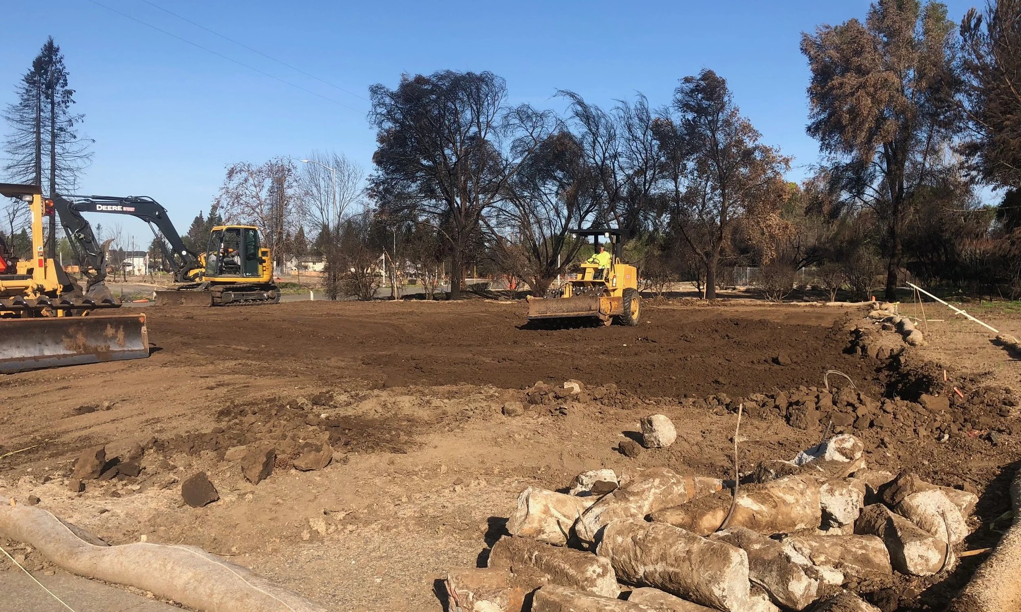 Utility pipe staged on a Daher Development jobsite